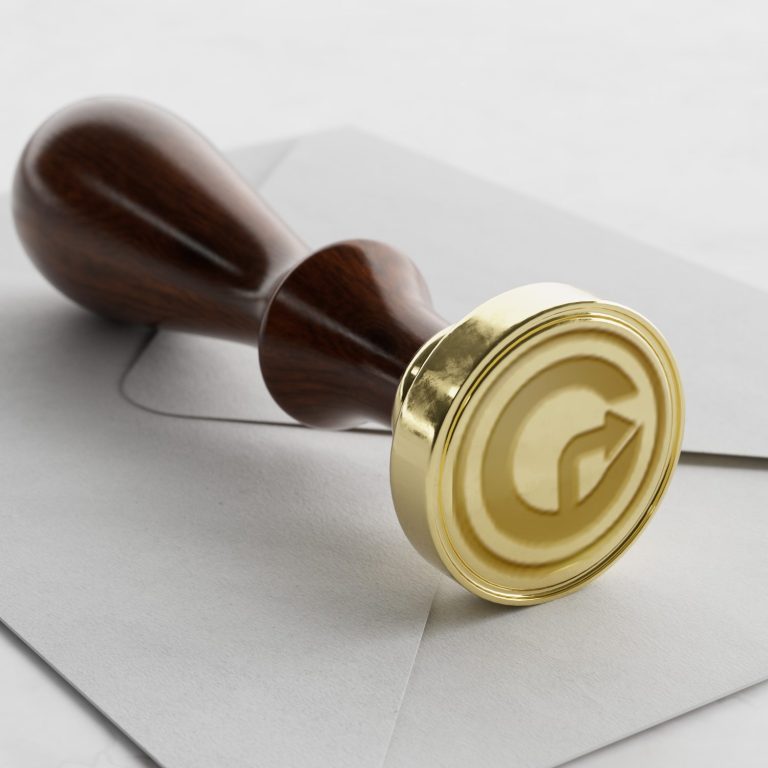 Berufsträger Wachssiegel mit einem stilisierten Buchstaben "G" auf einem Umschlag.